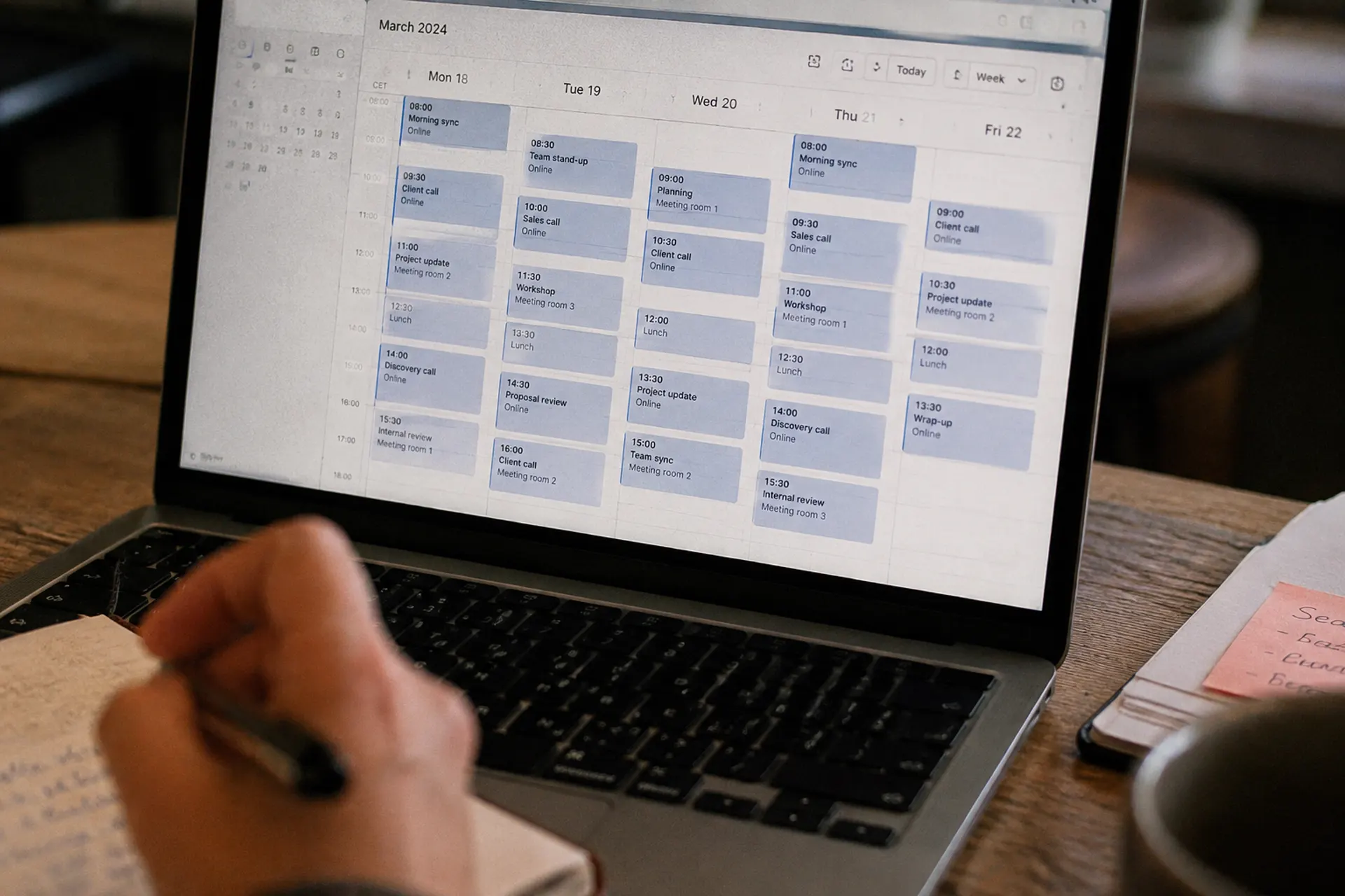 A laptop showing a working week filling up with client calls and meetings.